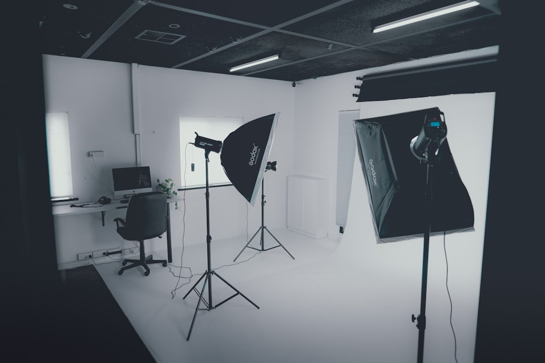 Empty modern TV studio with lighting rig and cameras